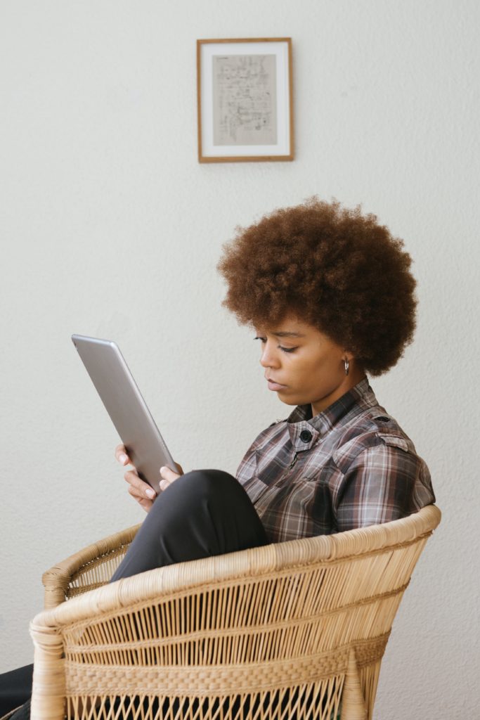 woman holding ipad